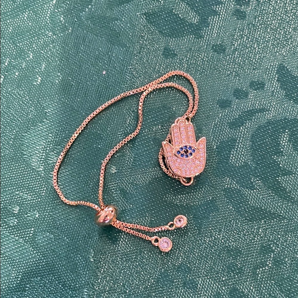 Gold Hamsa Hand Necklace with Blue Accents